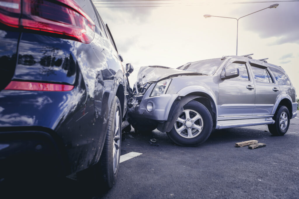 Car crash dangerous accident on the road. SUV car crashing besid This is a picture for a blog about hiring a personal injury lawyer.